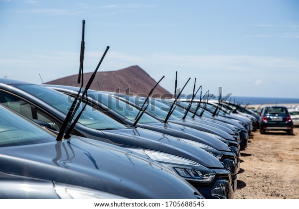 Rental cars in Tenerife parked outside the airport\
during the coronavirus crisis. Pandemic time and no tourist left 40\
000 cars unused