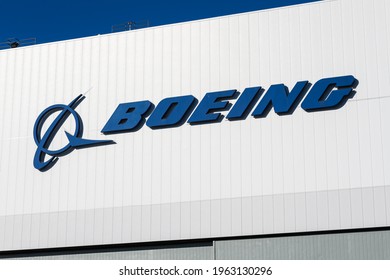 Renton, WA, USA - April 18, 2021; Boeing Corporation Logo On A White Building At The Renton Manufacturing Facility.  Boeing Is An Aerospace And Defense Manufacture And The Largest US Exporter