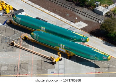 Renton, Washington / USA - September 09 2018: Pair of Boeing 737 (NG and MAX) fuselages wearing the protective anti corrosion green coat before entering the assembly line in Renton Airport facility.