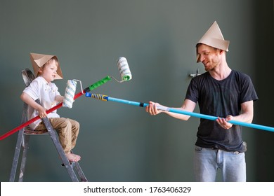 Repair In The Apartment. Happy Boy And His Dad Start Painting The Wall. Happy People Renovating Their New Home. Works In The Room, Makes Repairs. Unfinished Apartment Interior. Happy Father's Day