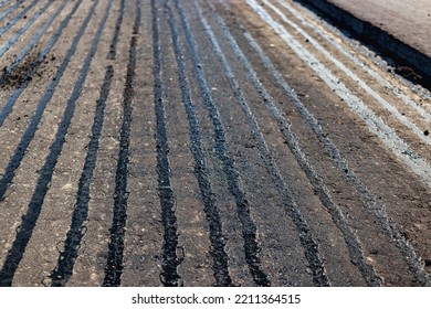 Repair Of Asphalt Pavement Of The Road. New Asphalt On The Road. Hot Bitumen When Laying New Asphalt