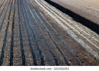 Repair Of Asphalt Pavement Of The Road. New Asphalt On The Road. Hot Bitumen When Laying New Asphalt