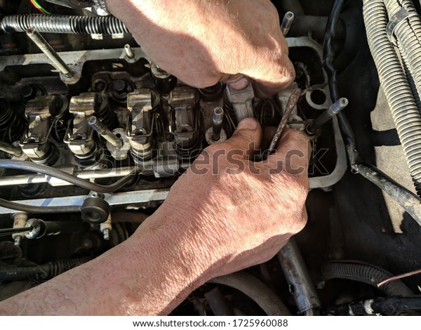 Repair of\
the automobile engine, adjustment of\
valves.