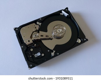 Repair broken computer part, open hard disc drive (hdd) with platters, spindle, actuator and read, write head isolated on white background, electronic hardware component service for pc