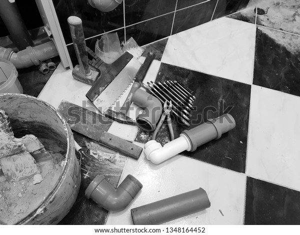 Repair - building with tools hammer,\
sledgehammer, pliers and keys on the tiled\
floor