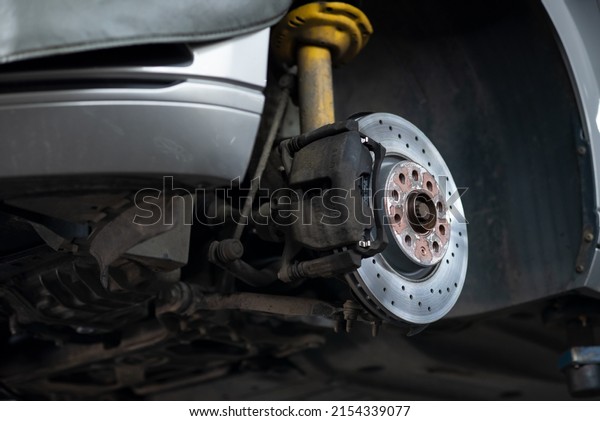 Repair of car brake pads on a\
lift