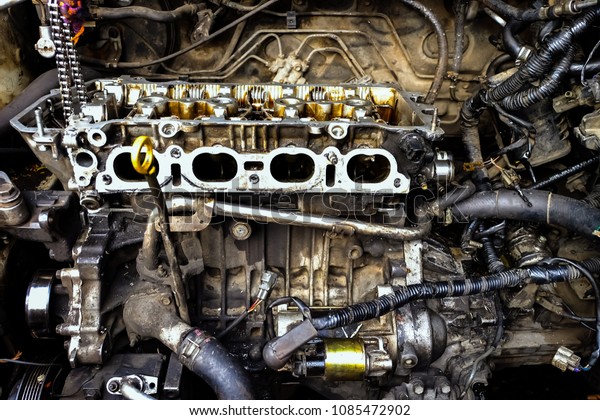 Repair car engine and fixing a car.\
Dirty car engine. concept of service and car maintenance\
