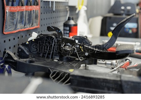 Repair of car pedals in a car service station