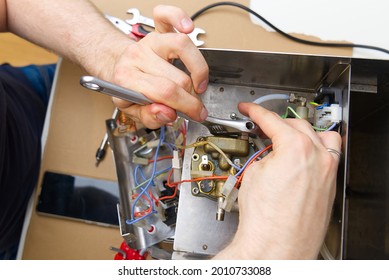 Repair Of Coffee Machine At Home. Spare Parts For The Espresso Machine. Repair Of Kitchen Appliances Service Concept