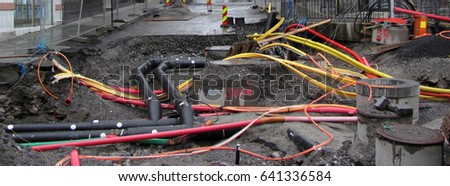 Repair of communications. Water supply, sewerage electrician. Excavated road in the city.