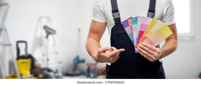 Repair, Construction And Building - Close Up Of Painter Or Builder With Color Charts Over Utility Room Background