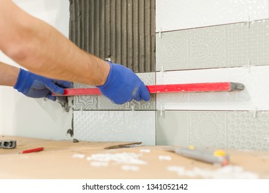 Repair And Construction Of The Kitchen, Hands Of Tiler Installing Ceramic Tiles On The Wall, Use Professional Tools, Real Laying Process.