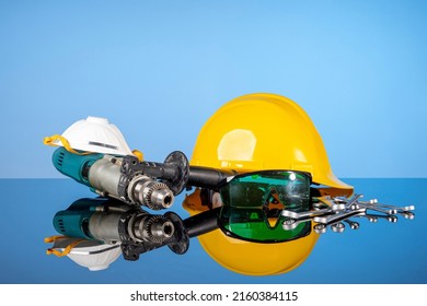 Repair and construction tools, safety helmet, drill and wrenches. Do it yourself concept, sale of goods for renovation and construction, home renovation services.