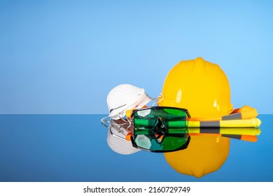 Repair and construction tools, safety helmet, vest, goggles and mask. Do it yourself concept, sale of goods for renovation and construction, home renovation services.