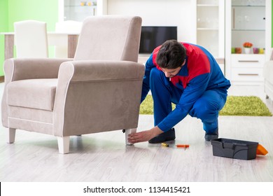 Repair Contractor Repairing Broken Furniture At Home