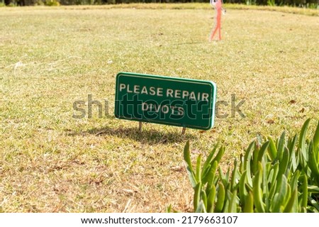 Repair divots sign at a golf course