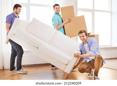 Repair, Furniture, Decorating And Home Concept - Smiling Friends With Sofa And Cardboard Boxes