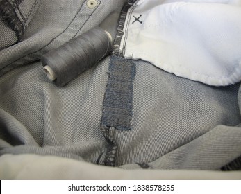 Repair Garments, Stitched Seams On A Worn Jeans Trousers With The Sewing Machine 