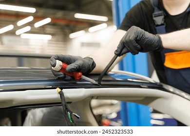 Repair and install auto glass with silicone rubber, the broken windshield in car accident	
 - Powered by Shutterstock