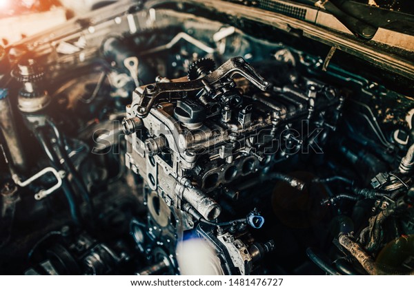 repair of an internal combustion engine of a car.\
Details of the motor.