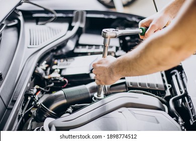Repair man making car service - Shutterstock ID 1898774512