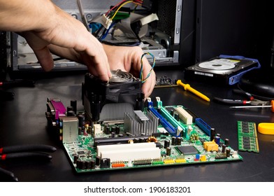 Repair of the motherboard in the service center. Replacing computer parts.