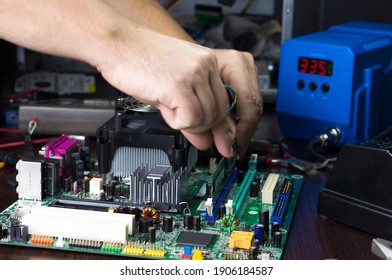Repair Of The Motherboard In The Service Center. Replacing Computer Parts.