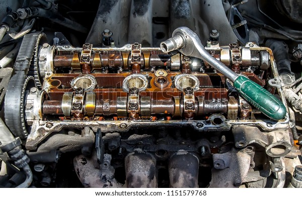 Repair of an old auto\
engine