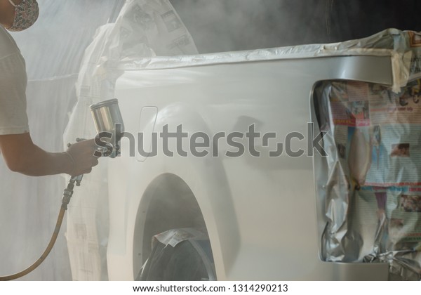 Repair and painting car car mechanic ,Spray paint\
hazards,dangerous work.