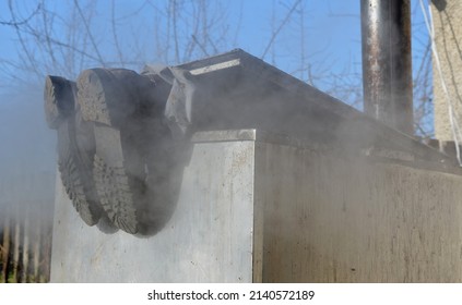 Repair Piping With Hot Water Steam In Hatch Of Device. Only Shoes And Feet Look Out Of Tank. Smoke Rolls In Winds Which Rolls Fog, Dust. Stainless Steel Kitchen Equipment Washes Inside Men, Film, Army