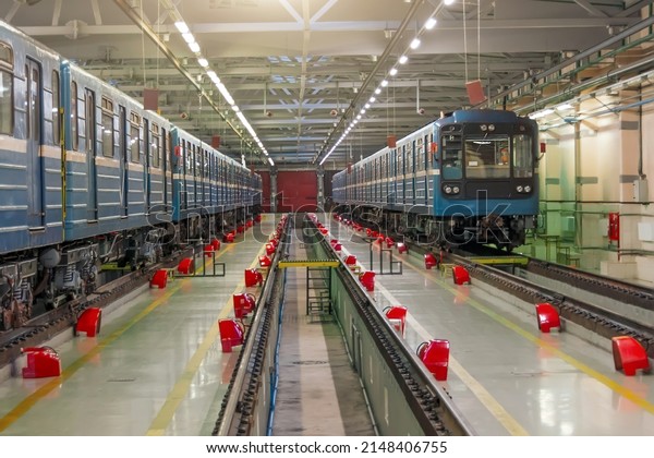 Repair pit and free rails in the depot hangar\
for metro cars, maintenance and repair of urban underground\
passenger transport