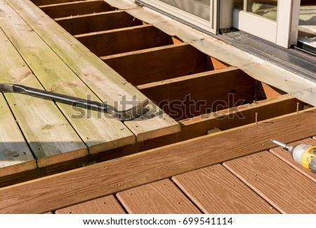 Repair and replacement of an old wooden deck or patio with modern composite plastic material
