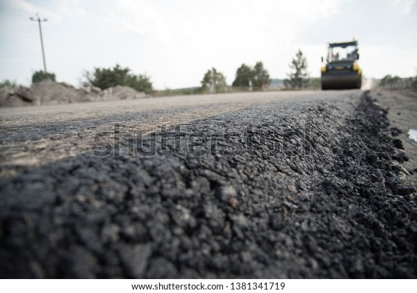 \
repair the road \
car\
asphalt street