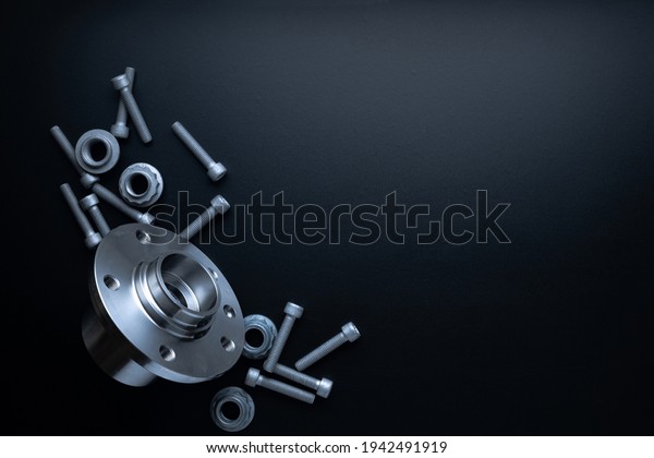 Repair service. Auto motor mechanic\
spare or automotive piece on dark background. Set of new metal car\
part. Repair and vehicle service with space for\
text