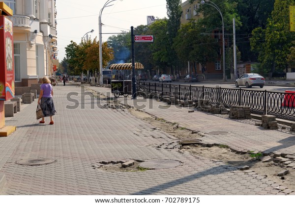 Repair of sidewalk, preparation for the FIFA World\
Cup 2018. Bolshaya Sadovaya Street, Rostov-on-Don, Russia. August\
24, 2017