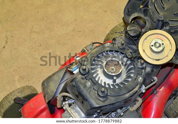 repair of
the starter of a gasoline lawn mower at
home