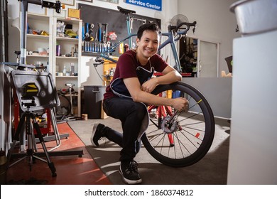 Repair technician bicycles was repaired gear bike shop. - Powered by Shutterstock