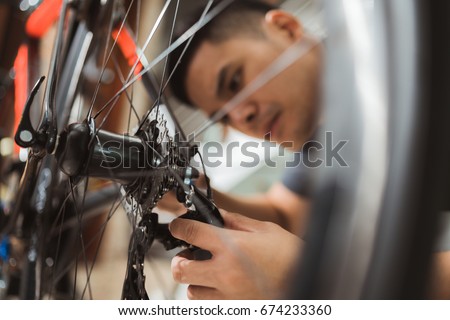 Repair technician bicycles was repaired gear bike shop.