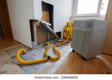 repair of water damage with air dryer - Shutterstock ID 2206968505