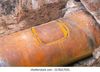 Repair of water supply networks by welding. Replacement of the old pipeline. Replacement of the pipe section by welding. Repair of a section on an iron pipe due to corrosion. Welding seam on the pipe