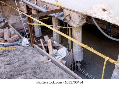 Repair Work On The Foundation Of A Building On Concrete Poles
