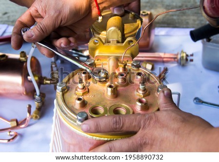 repairing a broken coffcee machine.support and repair coffcee machine. disassembled coffee machine