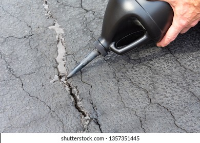 Repairing Cracks In Driveway With Asphalt Crack Filler