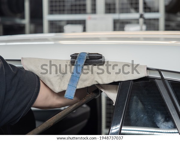 Repairing dents in a
car