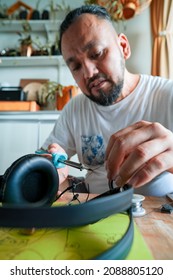 Repairing Electronic Circuit Board Inside Headphones With Soldering Iron At Home. DIY Project.