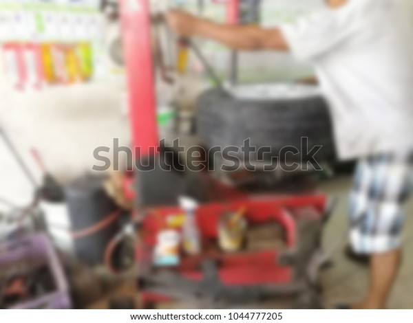 repairing flat car tire with repair kit for\
abstract background