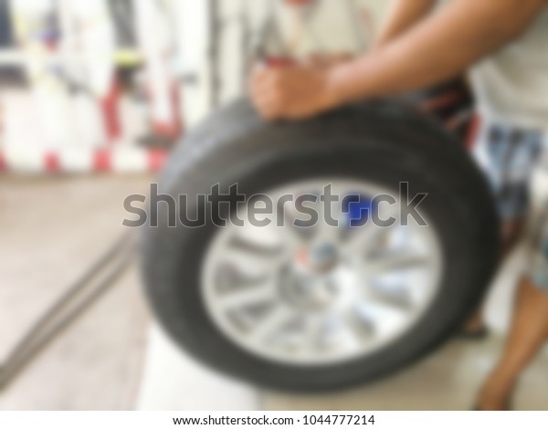 repairing flat car tire with repair kit for
abstract background