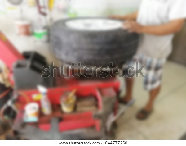 repairing flat car tire with repair kit for\
abstract background