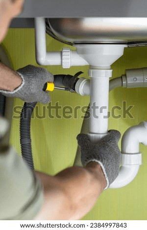 Repairing a pipe in the kitchen under the sink. connecting the washing machine drain. fix water plumbing leaks, replace the kitchen sink drain, cleaning clogged pipes is dirty or rusty.