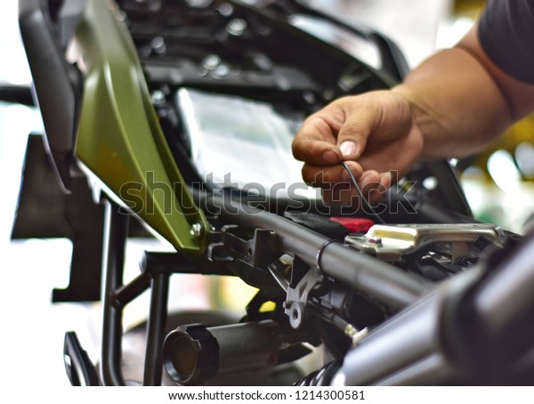 repairing power system of motorcycle, in motorcycle\
repair shop